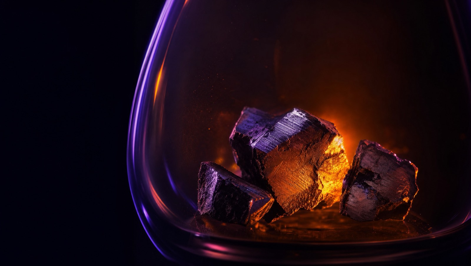 Recovered metal fragments in glass under amber rim light · Quantum Ventura, makers of CyberNeuro-RT (CNRT) · E-RECOV electrochemical metal recovery from electronic waste · applied AI/ML research and development · 26 federal SBIR and STTR contracts since 2019